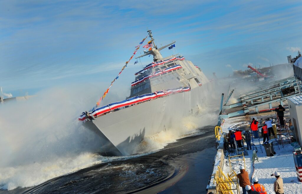 131218-N-EW716-001
MARINETTE, Wis. (Dec. 18, 2013) The littoral combat ship Pre-Commissioning Unit (PCU) Milwaukee (LCS 5) slides into Lake Michigan during a christening ceremony at the Marinette Marine Corporation shipyard. (U.S. Navy photo courtesy of Lockheed Martin/Released)