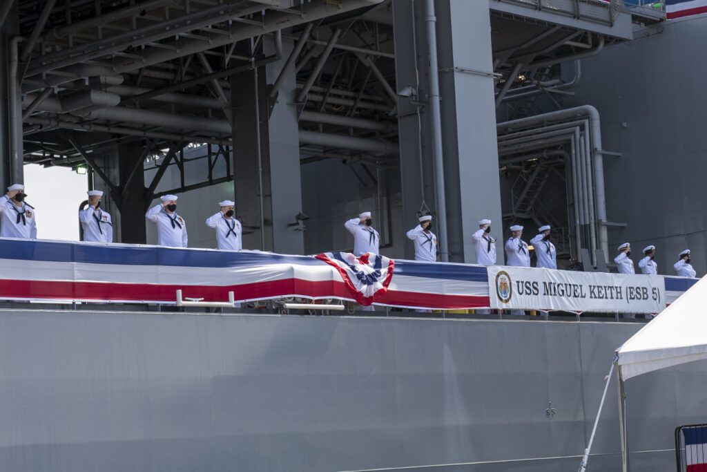 SAN DIEGO (May 8, 2021) The crew of the Lewis B. Puller-class expeditionary mobile base USS Miguel Keith (ESB 5) salute guests during the ship’s commissioning ceremony. Miguel Keith is the Navy’s third purpose-built expeditionary sea base (ESB). While originally created to operate as a support ship under Military Sealift Command, Miguel Keith has been commissioned to provide greater mission flexibility in accordance with the laws of armed conflict. It is the first U.S. warship named for Marine Corps Lance Cpl. Miguel Keith, who was posthumously awarded the Medal of Honor for heroism in Vietnam. (U.S. Navy photo by Mass Communication Specialist 2nd Class Kevin C. Leitner)