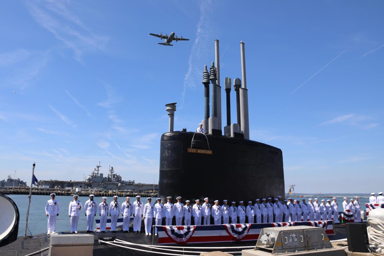 NORFOLK (June 25, 2022) Sailors attached to the Virginia-class fast attack submarine USS Montana (SSN 794) man the boat during a commissioning ceremony in Norfolk, Va., June 25, 2022. SSN-794, the second U.S Navy vessel launched with the name Montana and first in more than a century, is a flexible, multi-mission platform designed to carry out the seven core competencies of the submarine force: anti-submarine warfare; anti-surface warfare; delivery of special operations forces; strike warfare; irregular warfare; intelligence, surveillance and reconnaissance; and mine warfare. (U.S. Navy photo by Senior Chief Mass Communication Specialist John Smolinski)