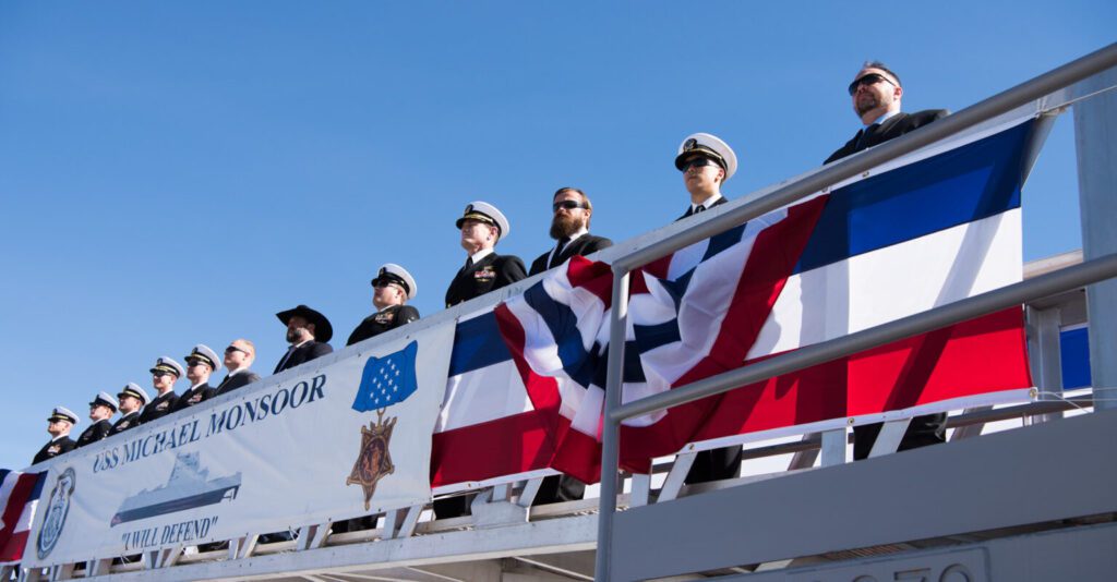 SAN DIEGO (Jan. 26, 2019) Former members of SEAL Team Three join the ship's crew to bring the Navy's newest Zumwalt-class destroyer, USS Michael Monsoor (DDG 1001), to life during its commissioning ceremony. DDG 1001 is the second Zumwalt destroyer ship to enter the fleet. It is the first Navy combat ship named for fallen Master-at-Arms 2nd Class (SEAL) Michael Monsoor, who was posthumously awarded the Medal of Honor for his heroic actions while serving in Ramadi, Iraq, in 2006. (U.S. Navy photo by Mass Communication Specialist 3rd Class Devin M. Monroe)