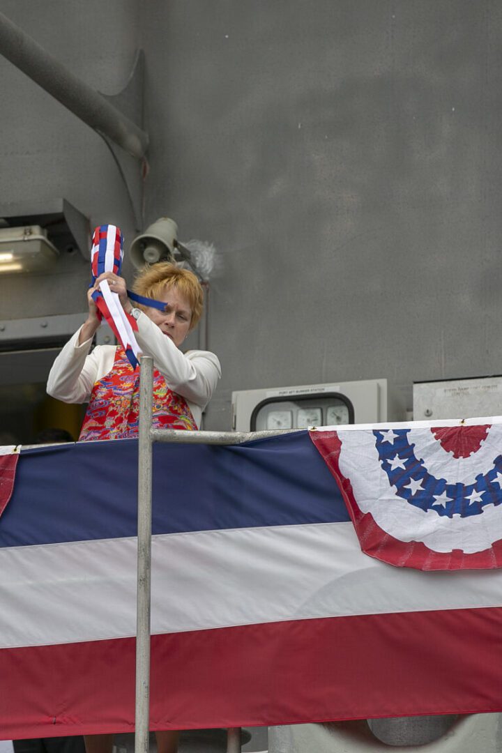 190427-N-IX266-005 NAHA, Japan—Bruni Bradley, sponsor to Military Sealift Command’s high-speed transport USNS Guam (T-HST 1), breaks a bottle during the christening ceremony of USNS Guam, April 27. Bradley, a 25-year Navy veteran, officially declared the Guam christened after breaking a bottle of sparkling wine against the ship’s side railing of the main deck. (Navy photo by Grady T. Fontana/Released)