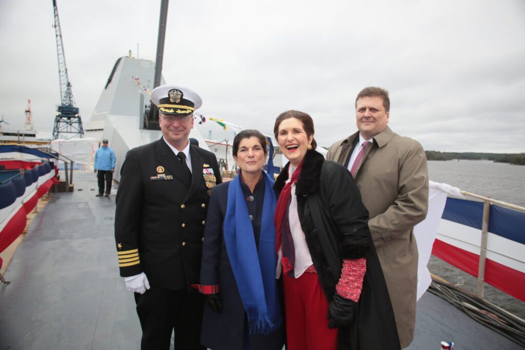 190427-N-N0101-111
BATH, Maine (April 27, 2019) Capt. Jeremy Gray, left, prospective commanding officer of the the future Zumwalt-class guided-missile destroyer USS Lyndon B. Johnson (DDG 1003); Luci Baines Johnson and Lynda Johnson Robb, ship's sponsors and daughters of former President Lyndon B. Johnson, the ship's namesake; and Dirk Lesko, president of General Dynamics Bath Iron Works; pose for a photo aboard Pre-Commissioning Unit (PCU) Lyndon B. Johnson during the ship's christening ceremony, April 27, 2019 at Bath Iron Works in Bath, Maine. Lyndon B. Johnson is the third ship in the Zumwalt class of guided-missile destroyers. (U.S. Navy photo courtesy of Bath Iron Works/Released)