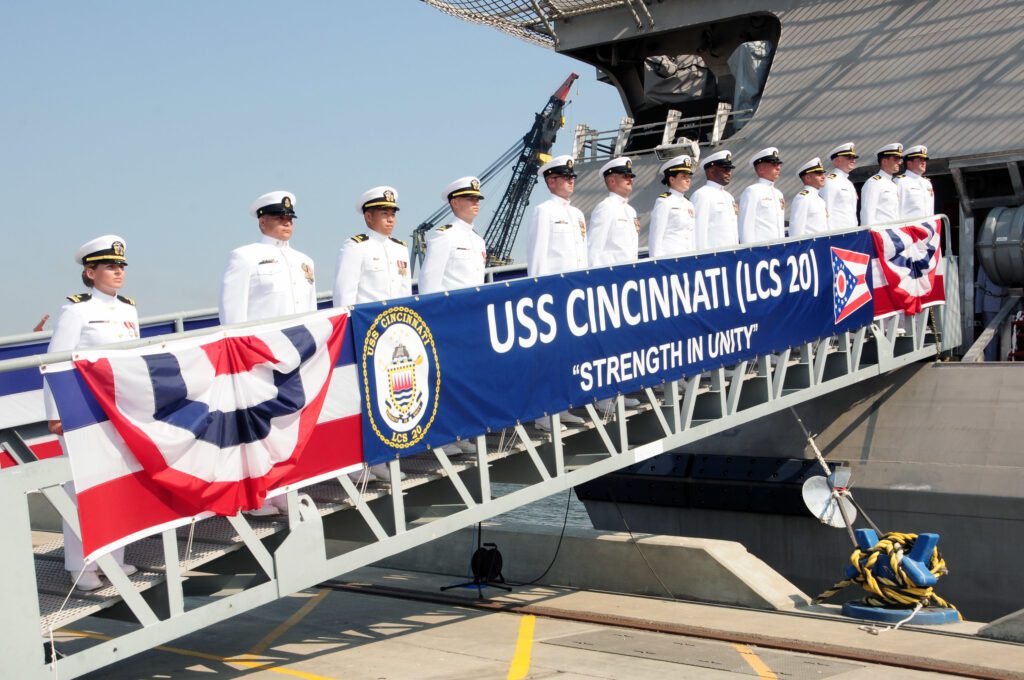GULFPORT, Miss. (Oct. 5, 2019) – The crew of the Independence-variant littoral combat ship, USS Cincinnati (LCS 20) mans the ship during the commissioning ceremony in Gulfport, Miss.  LCS 20, the fifth ship in naval history to be named Cincinnati, will be homeported at Naval Base San Diego. (U.S. Navy photo by Chief Mass Communication Specialist Rosalie Chang)